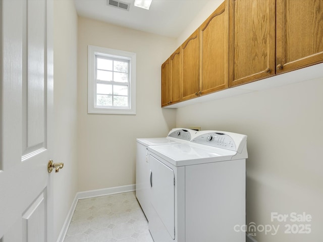 laundry room featuring separate washer and dryer, baseboards, cabinet space, and visible vents