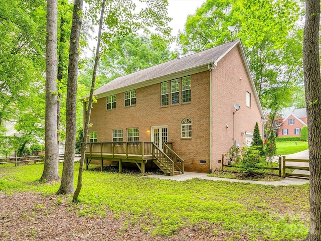 back of house with stairs, a lawn, fence, and a deck
