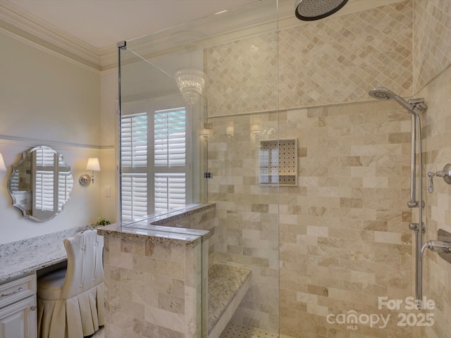 full bath featuring crown molding and tiled shower