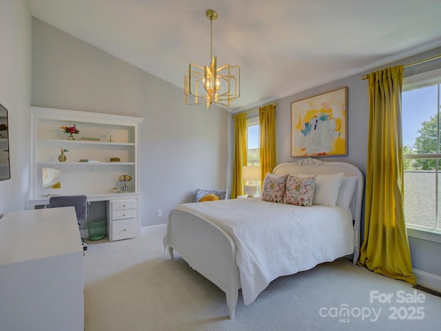carpeted bedroom with baseboards, a chandelier, lofted ceiling, and visible vents