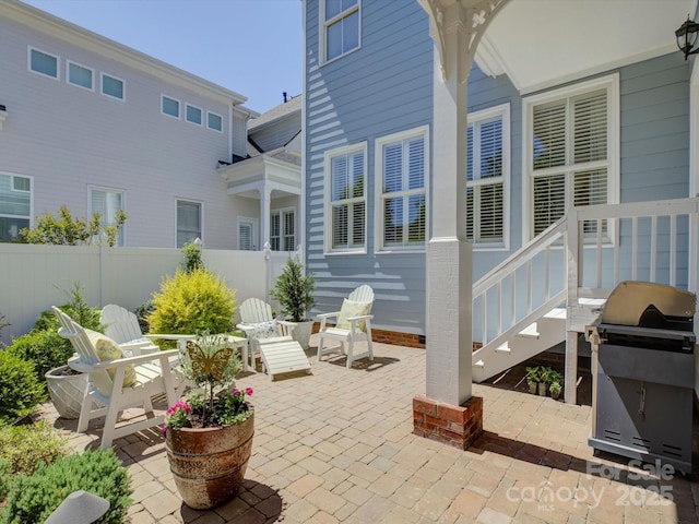 exterior space with fence and a patio area