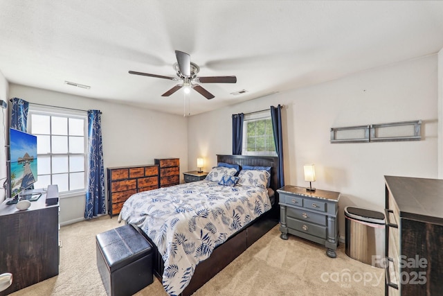 8259 Carob Tree Ln, Charlotte, NC 28215 - bedroom featuring light colored carpet, baseboards, and ceiling fan