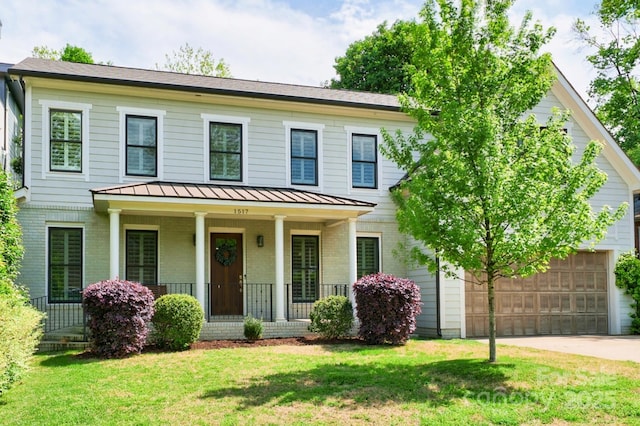 1517 Waverly Ave, Charlotte, NC 28203 - view of front of home with covered porch, brick siding, a standing seam roof, and a front lawn