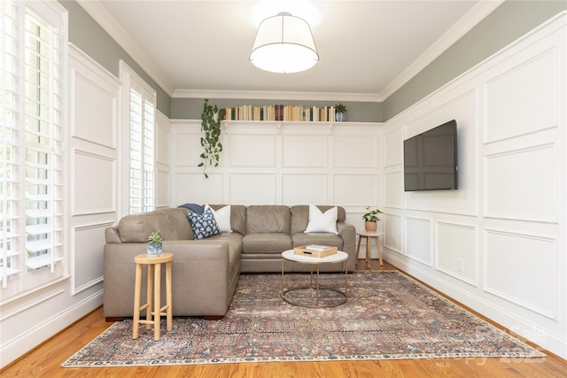 1517 Waverly Ave, Charlotte, NC 28203 - living room with a decorative wall, wood finished floors, and ornamental molding