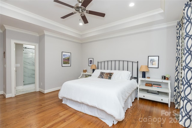 1517 Waverly Ave, Charlotte, NC 28203 - bedroom featuring wood finished floors, recessed lighting, a raised ceiling, crown molding, and baseboards