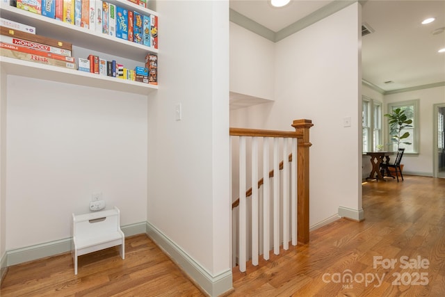 1517 Waverly Ave, Charlotte, NC 28203 - hallway with an upstairs landing, wood finished floors, recessed lighting, and baseboards