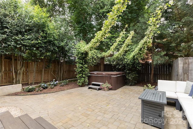 1517 Waverly Ave, Charlotte, NC 28203 - view of patio / terrace with a hot tub, a fenced backyard, and an outdoor living space