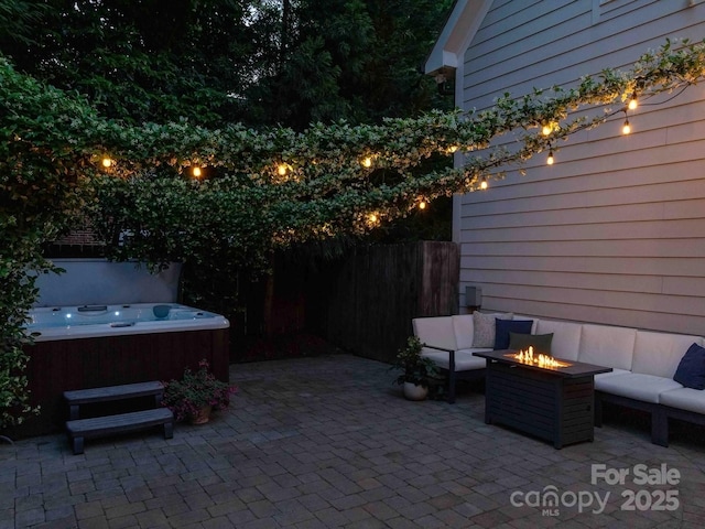 1517 Waverly Ave, Charlotte, NC 28203 - view of patio featuring a hot tub, fence, and an outdoor living space with a fire pit