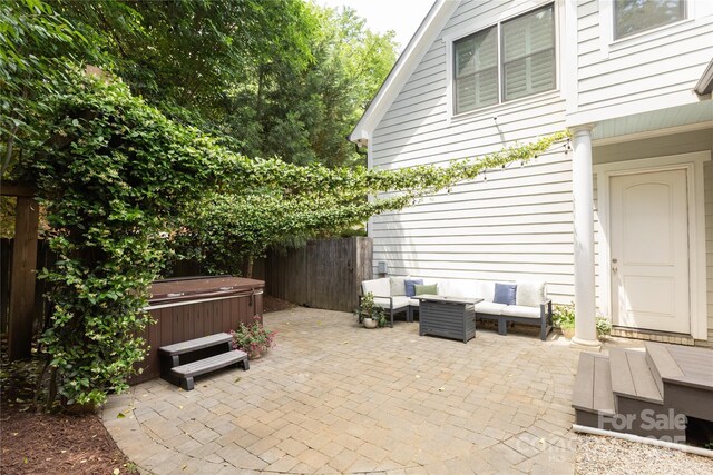 1517 Waverly Ave, Charlotte, NC 28203 - view of patio with a hot tub, a fenced backyard, and an outdoor living space