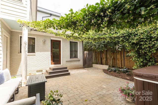 1517 Waverly Ave, Charlotte, NC 28203 - view of patio / terrace featuring a hot tub, a fenced backyard, and entry steps
