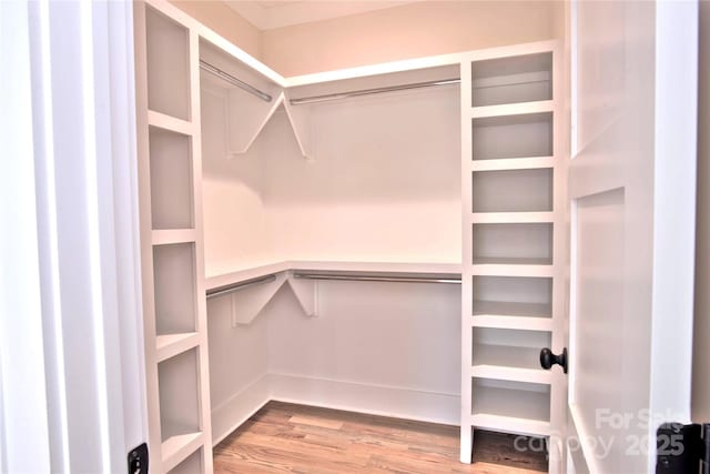 116 S Broad St, Waxhaw, NC 28173 - walk in closet featuring wood finished floors