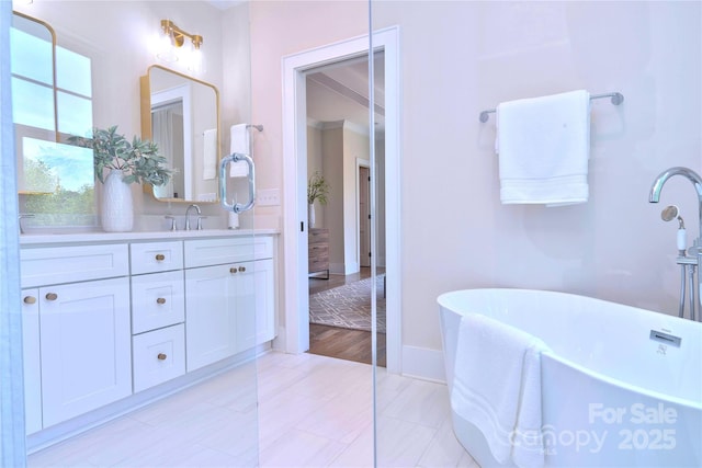 116 S Broad St, Waxhaw, NC 28173 - full bath with baseboards, a freestanding bath, and vanity