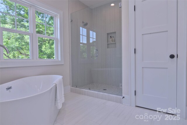 116 S Broad St, Waxhaw, NC 28173 - full bathroom with a soaking tub and a shower stall