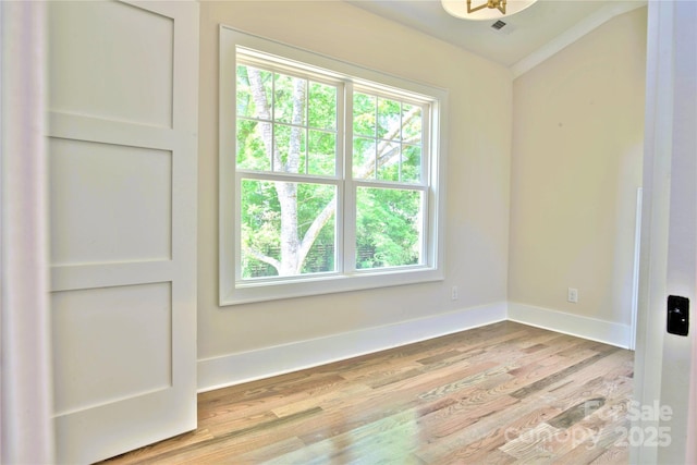 116 S Broad St, Waxhaw, NC 28173 - unfurnished room featuring baseboards, plenty of natural light, light wood-type flooring, and visible vents