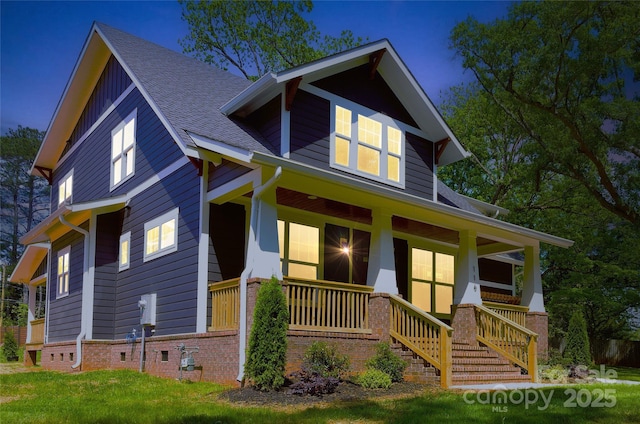 116 S Broad St, Waxhaw, NC 28173 - view of front of house with board and batten siding, a shingled roof, and a porch
