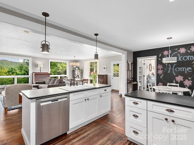 kitchen with a kitchen island, dark wood-style flooring, dark countertops, dishwasher, and a sink