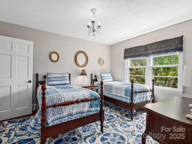 bedroom featuring an inviting chandelier