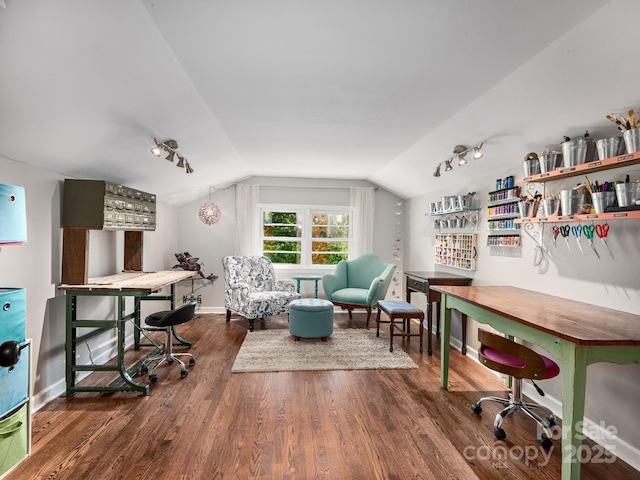 office area with wood finished floors, rail lighting, baseboards, and lofted ceiling