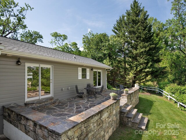 view of patio featuring fence