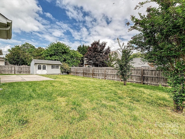 5355 Hackberry Ln SW, Concord, NC 28027 - view of yard featuring a fenced backyard, a patio, and an outbuilding