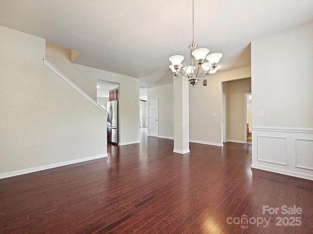 5355 Hackberry Ln SW, Concord, NC 28027 - interior space featuring dark wood-style flooring and a notable chandelier