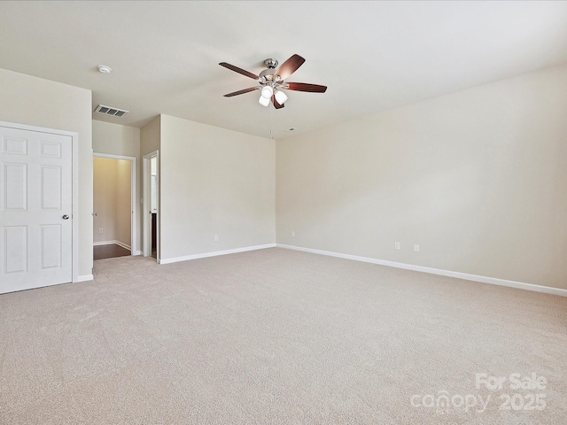 5355 Hackberry Ln SW, Concord, NC 28027 - carpeted spare room featuring a ceiling fan, baseboards, and visible vents