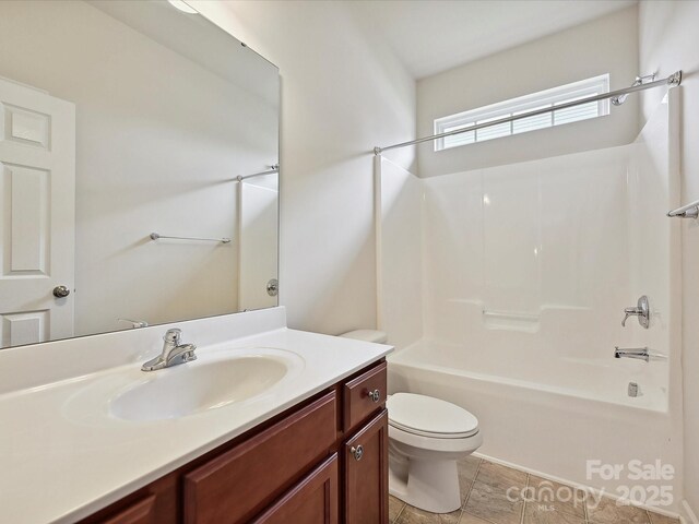 5355 Hackberry Ln SW, Concord, NC 28027 - full bathroom with toilet, bathing tub / shower combination, and vanity
