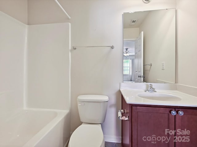 5355 Hackberry Ln SW, Concord, NC 28027 - bathroom featuring visible vents, shower / bathtub combination, toilet, and vanity