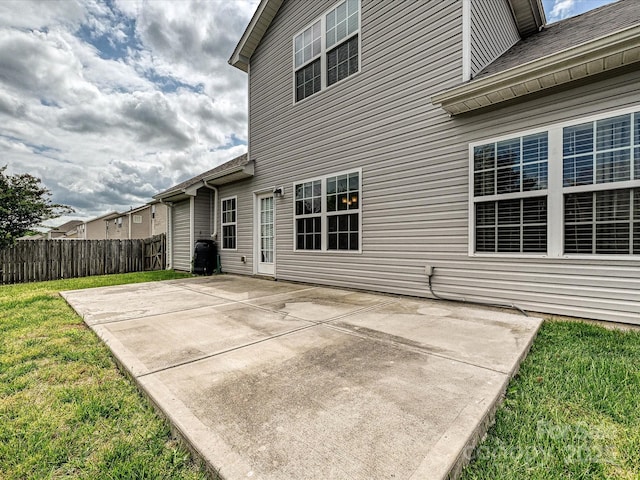 5355 Hackberry Ln SW, Concord, NC 28027 - rear view of house with a patio, a lawn, and fence