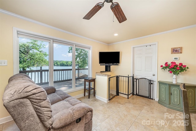 living room with crown molding, ceiling fan, and light tile patterned floors