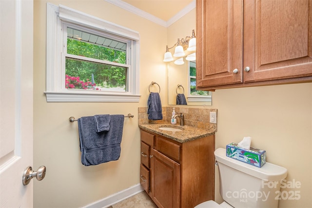 half bath featuring decorative backsplash, crown molding, vanity, baseboards, and toilet