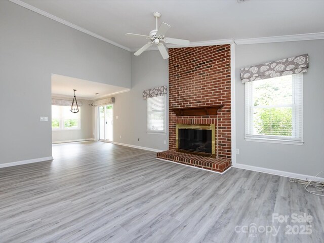 2502 Breuster Dr, Charlotte, NC 28210 - unfurnished living room with baseboards, ceiling fan, ornamental molding, and wood finished floors