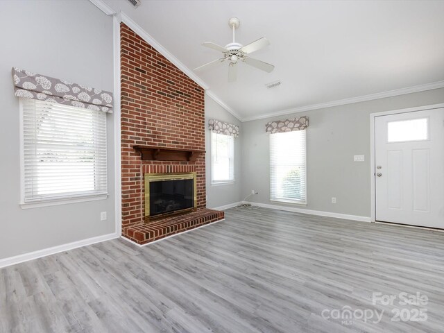2502 Breuster Dr, Charlotte, NC 28210 - unfurnished living room with crown molding, ceiling fan, wood finished floors, and lofted ceiling