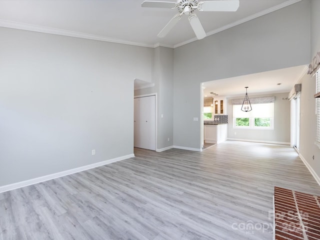 2502 Breuster Dr, Charlotte, NC 28210 - unfurnished living room with a ceiling fan, baseboards, and ornamental molding