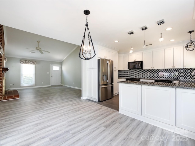 2502 Breuster Dr, Charlotte, NC 28210 - kitchen with crown molding, black microwave, baseboards, stainless steel fridge with ice dispenser, and a ceiling fan