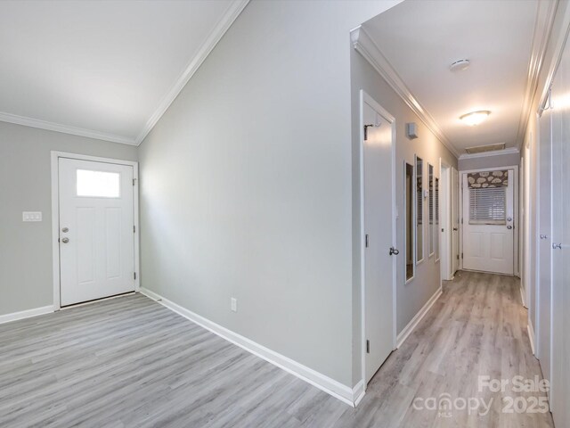 2502 Breuster Dr, Charlotte, NC 28210 - entryway with baseboards, ornamental molding, and light wood-style floors