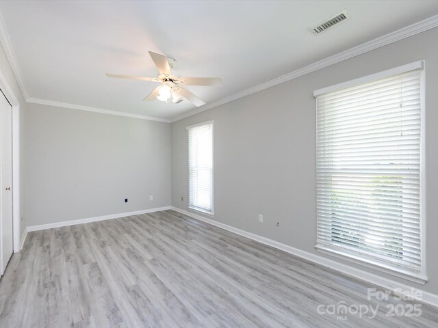 2502 Breuster Dr, Charlotte, NC 28210 - interior space with visible vents, a ceiling fan, light wood-style floors, and crown molding