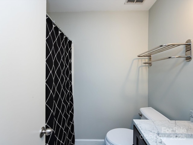 2502 Breuster Dr, Charlotte, NC 28210 - full bath featuring visible vents, vanity, baseboards, toilet, and a shower with shower curtain