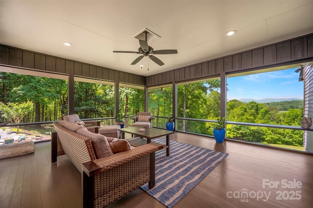 sunroom / solarium with ceiling fan