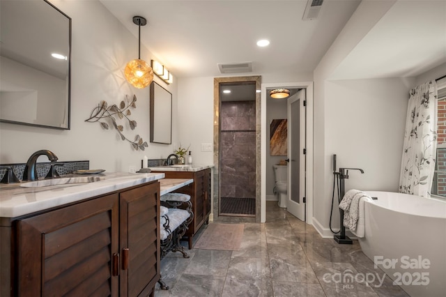 full bath with a soaking tub, a shower stall, marble finish floor, and visible vents