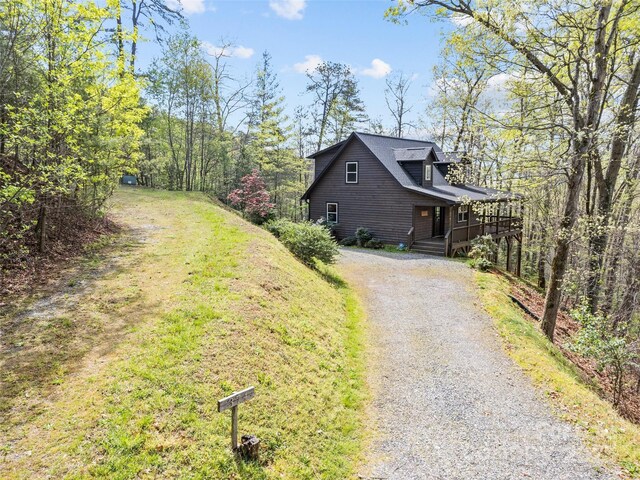 view of property exterior with aphalt driveway
