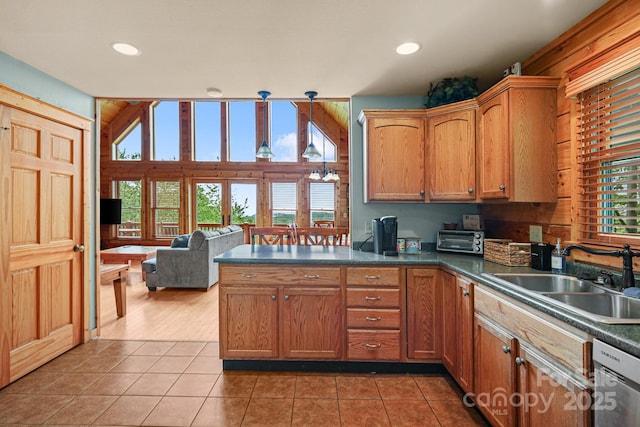 59 Valley Hts, Mars Hill, NC 28754 - kitchen with a sink, dark countertops, a peninsula, light tile patterned floors, and stainless steel dishwasher