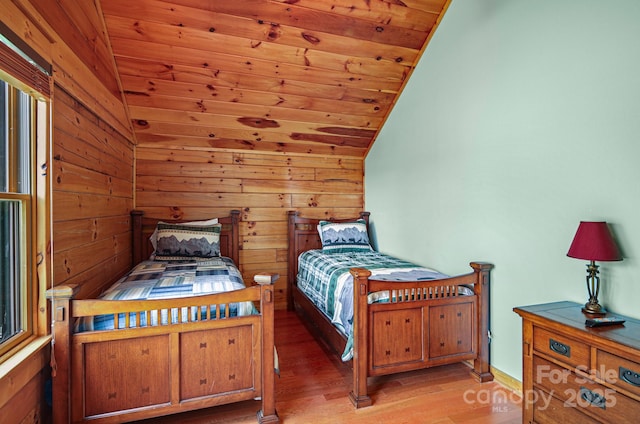 59 Valley Hts, Mars Hill, NC 28754 - bedroom with vaulted ceiling, wooden ceiling, light wood-style flooring, and wooden walls