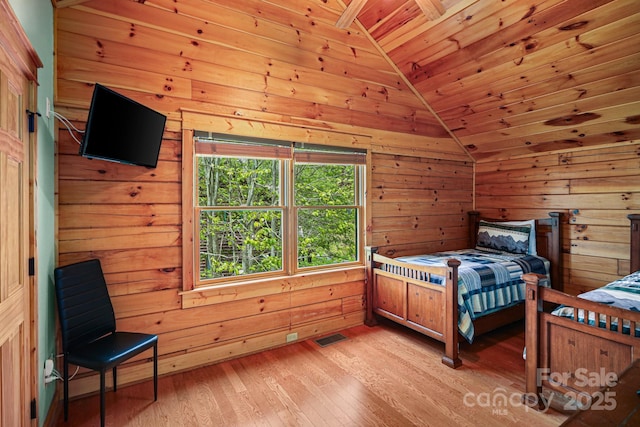 59 Valley Hts, Mars Hill, NC 28754 - bedroom with lofted ceiling, wooden ceiling, light wood-type flooring, and wooden walls