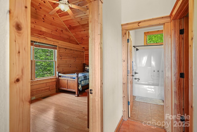59 Valley Hts, Mars Hill, NC 28754 - unfurnished bedroom featuring lofted ceiling, wood-type flooring, wood ceiling, connected bathroom, and wood walls