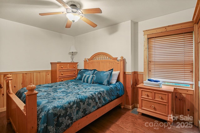 59 Valley Hts, Mars Hill, NC 28754 - bedroom with wood finished floors, wainscoting, wooden walls, and ceiling fan
