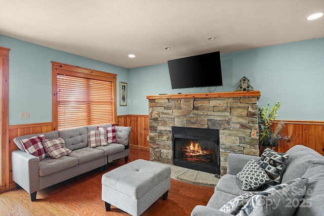 59 Valley Hts, Mars Hill, NC 28754 - living area featuring wainscoting, wooden walls, light wood-style floors, a fireplace, and recessed lighting