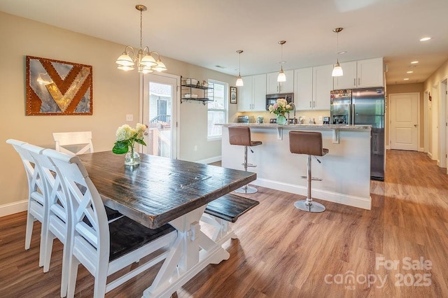 10 Half Moon Dr, Swannanoa, NC 28778 - dining room featuring light wood-style floors, recessed lighting, baseboards, and an inviting chandelier