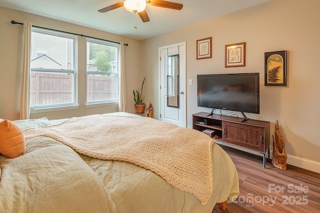 10 Half Moon Dr, Swannanoa, NC 28778 - bedroom with baseboards, ceiling fan, and wood finished floors