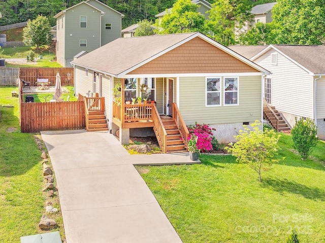 10 Half Moon Dr, Swannanoa, NC 28778 - bungalow-style house with fence, stairs, covered porch, and a front yard